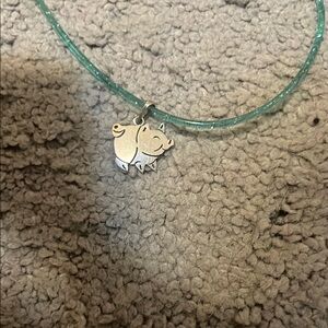 Blue chain and pig pendant